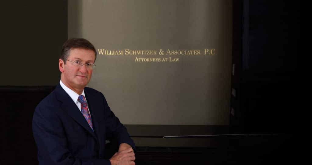 Mr. Schwitzer posing in his office