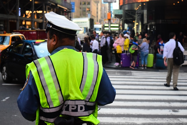 NYPD officers directing traffic at a busy NYC Traffic Accidents Fall 2025.