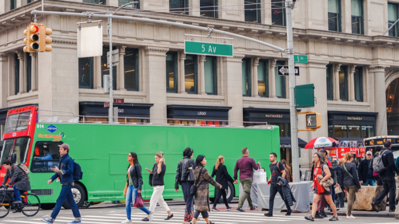 City intersection with crosswalk representing SUV crashes into NYC storefront and urban safety