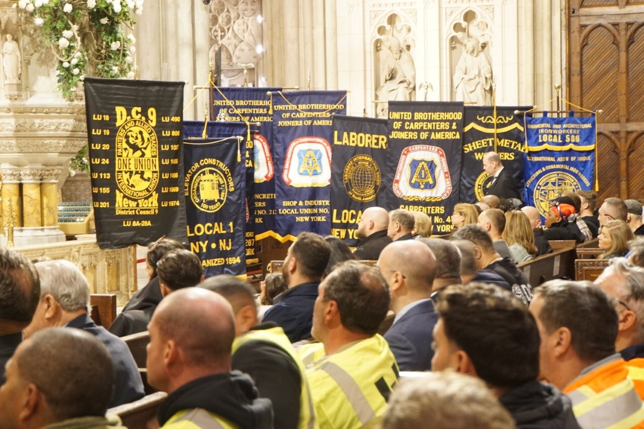 Construction union banners displayed during memorial mass honoring workers killed or injured on jobsites at St. Patrick’s Cathedral in New York City
